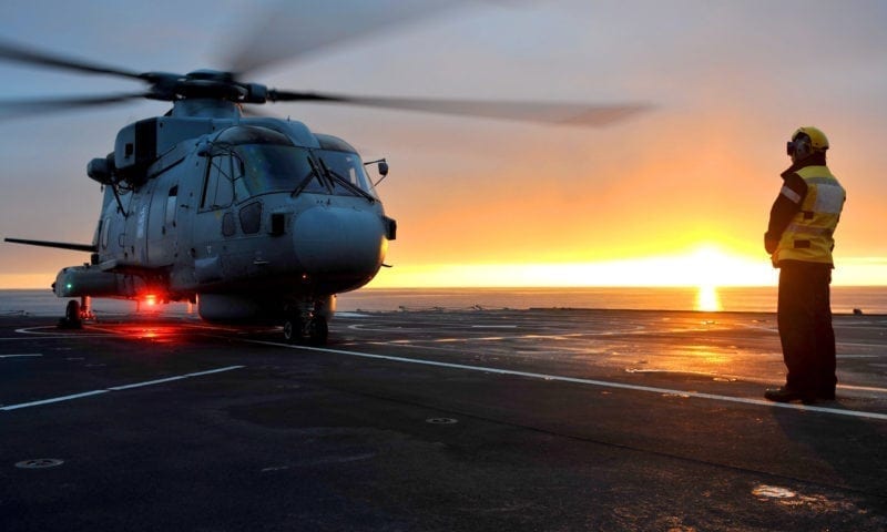 Royal Navy Merlin Helicopter Prepares to Takeoff from RFA Argus
